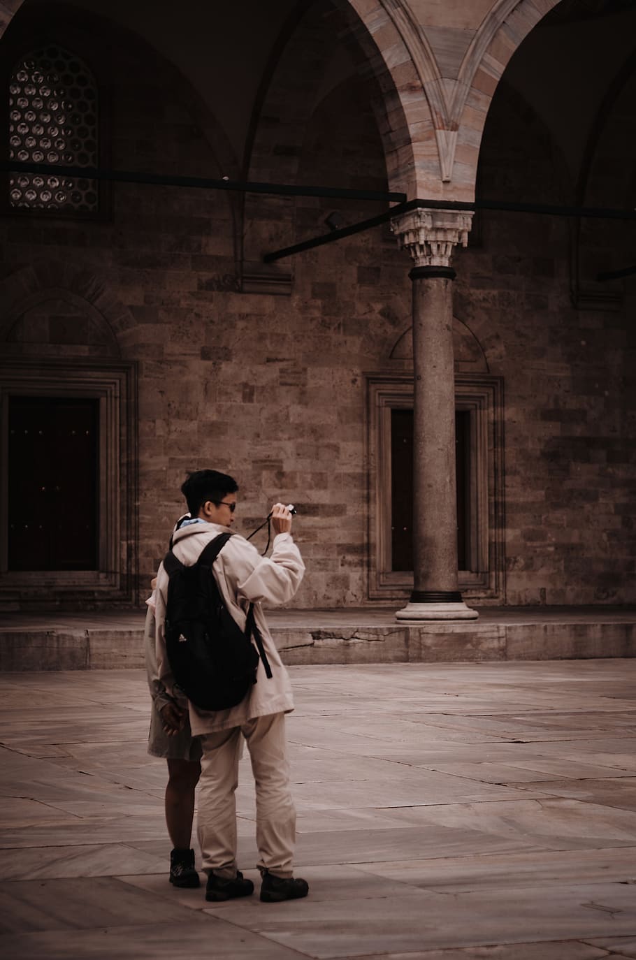 Man Standing Near Building, backpack, camera, group, group together HD wallpaper