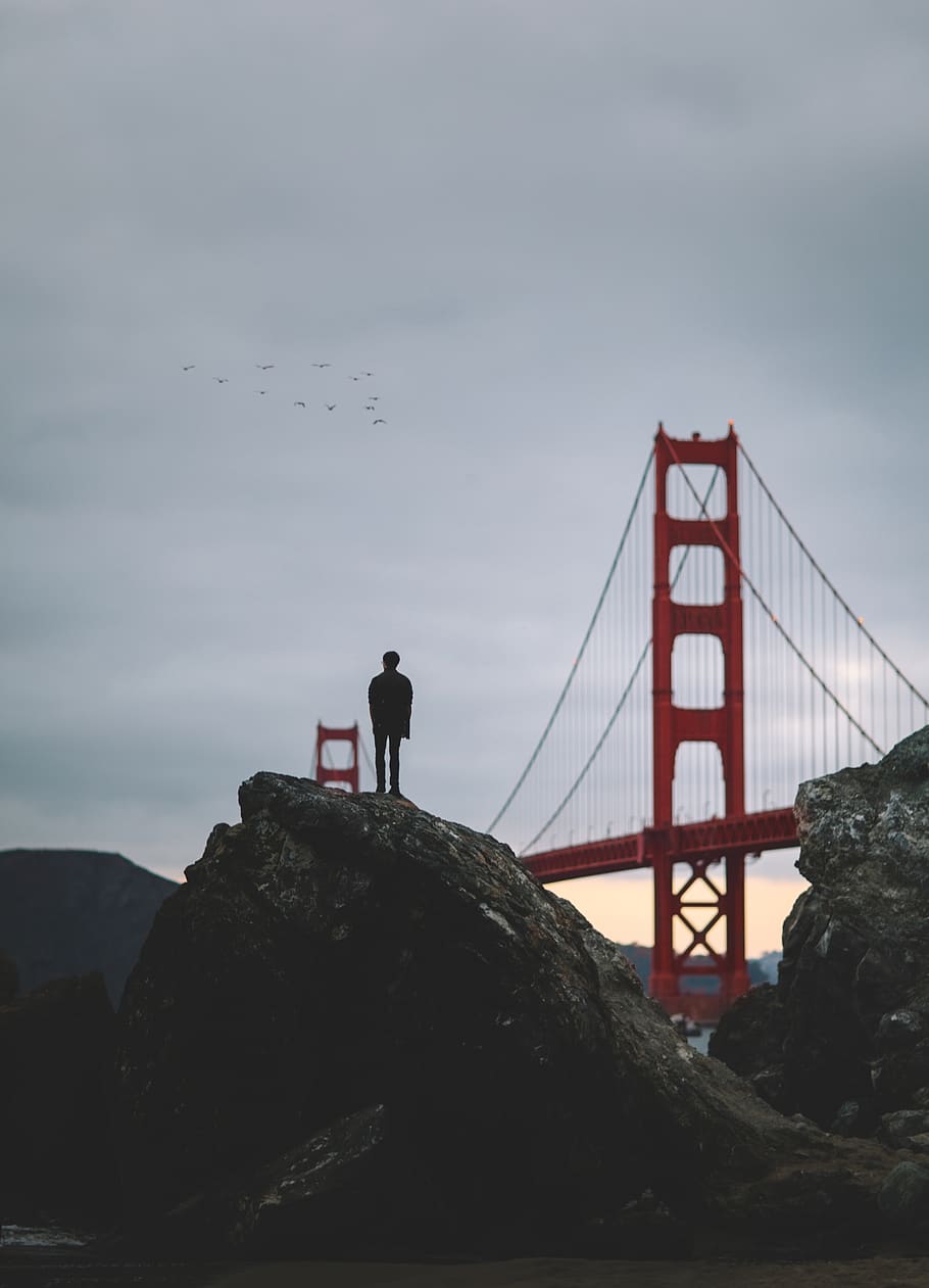 people, man, alone, rocks, hill, bridge, architecture, travel HD wallpaper