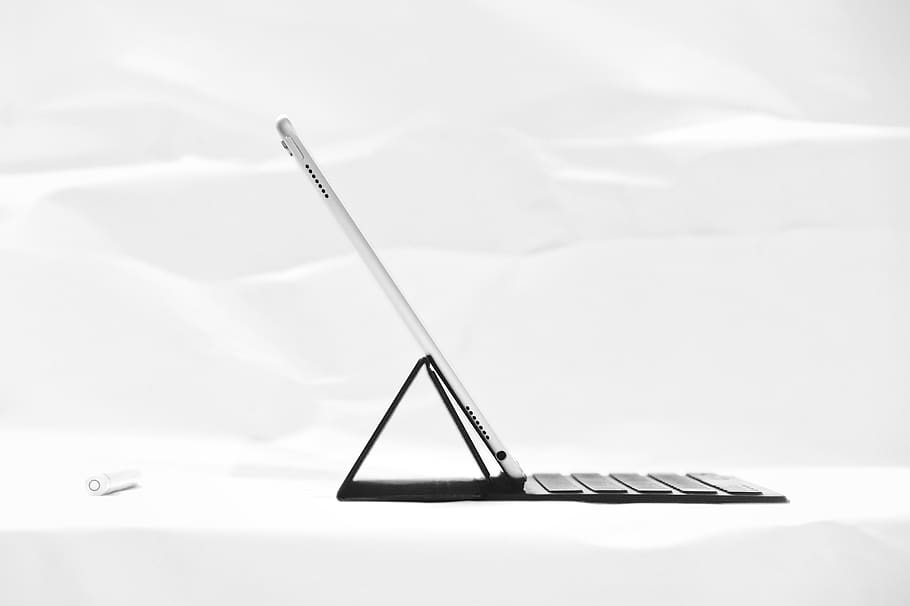 silver iPad on black dock keyboard, laptop, studio shot, no people HD wallpaper