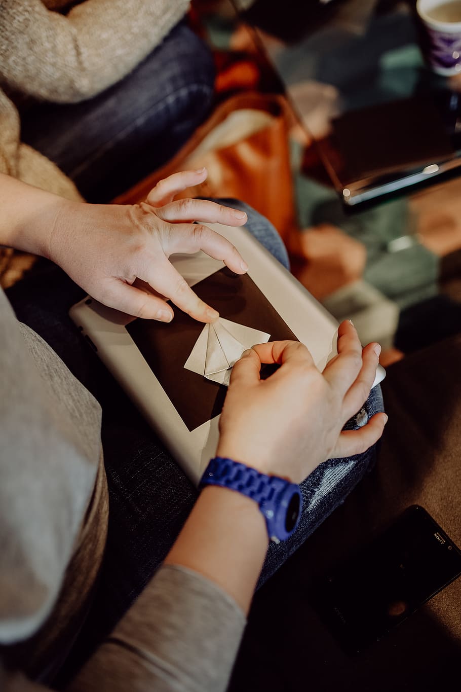 Women folding sheet of paper while making origami, creative, workshop HD wallpaper