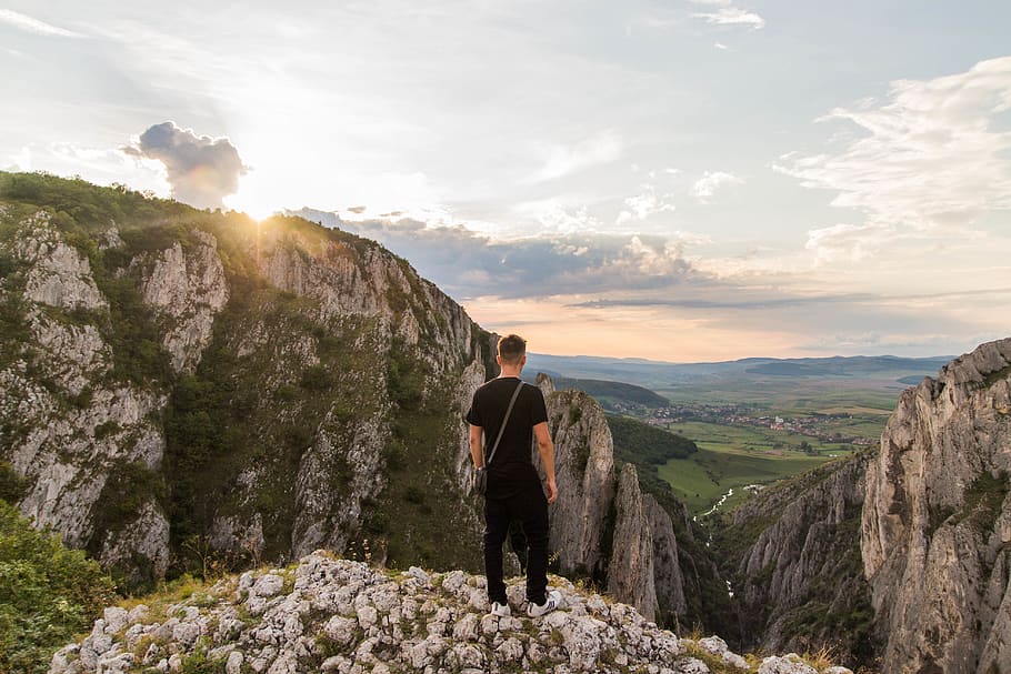 Man Standing on Gray Mountain Cliff, climb, clouds, daylight HD wallpaper