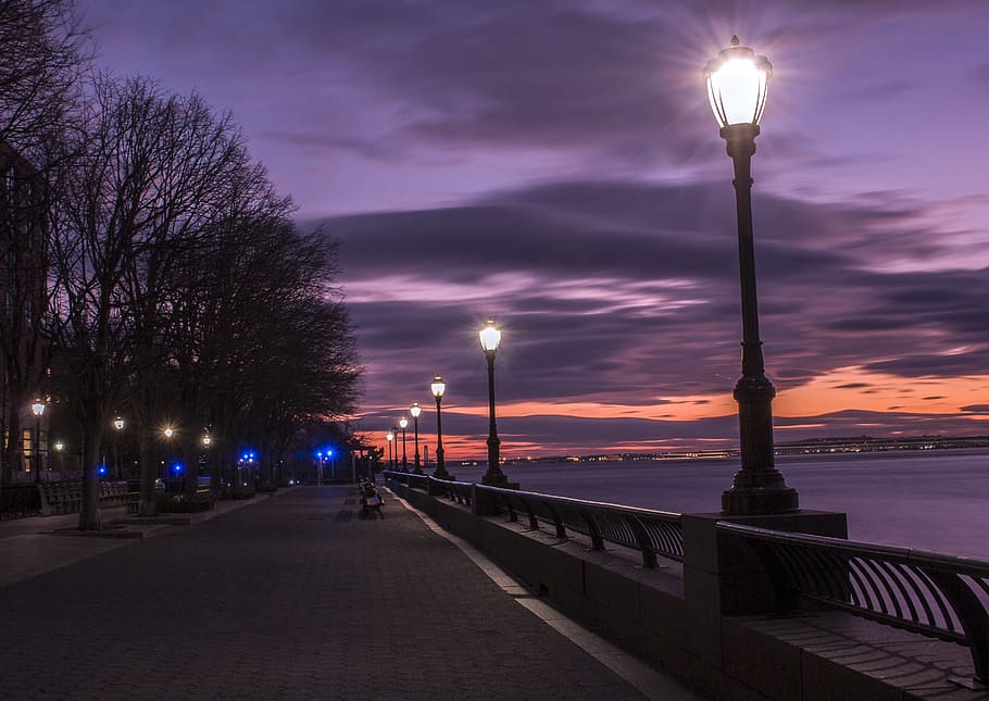 Photography of Turned on Street Lamps Beside Bay during Night Time HD wallpaper