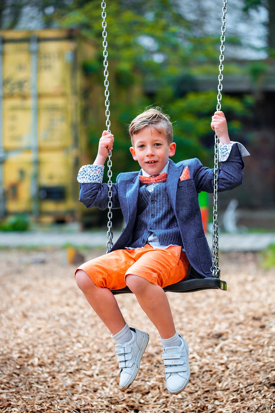 boy in pinstriped suit jacket on swing, apparel, shoe, footwear