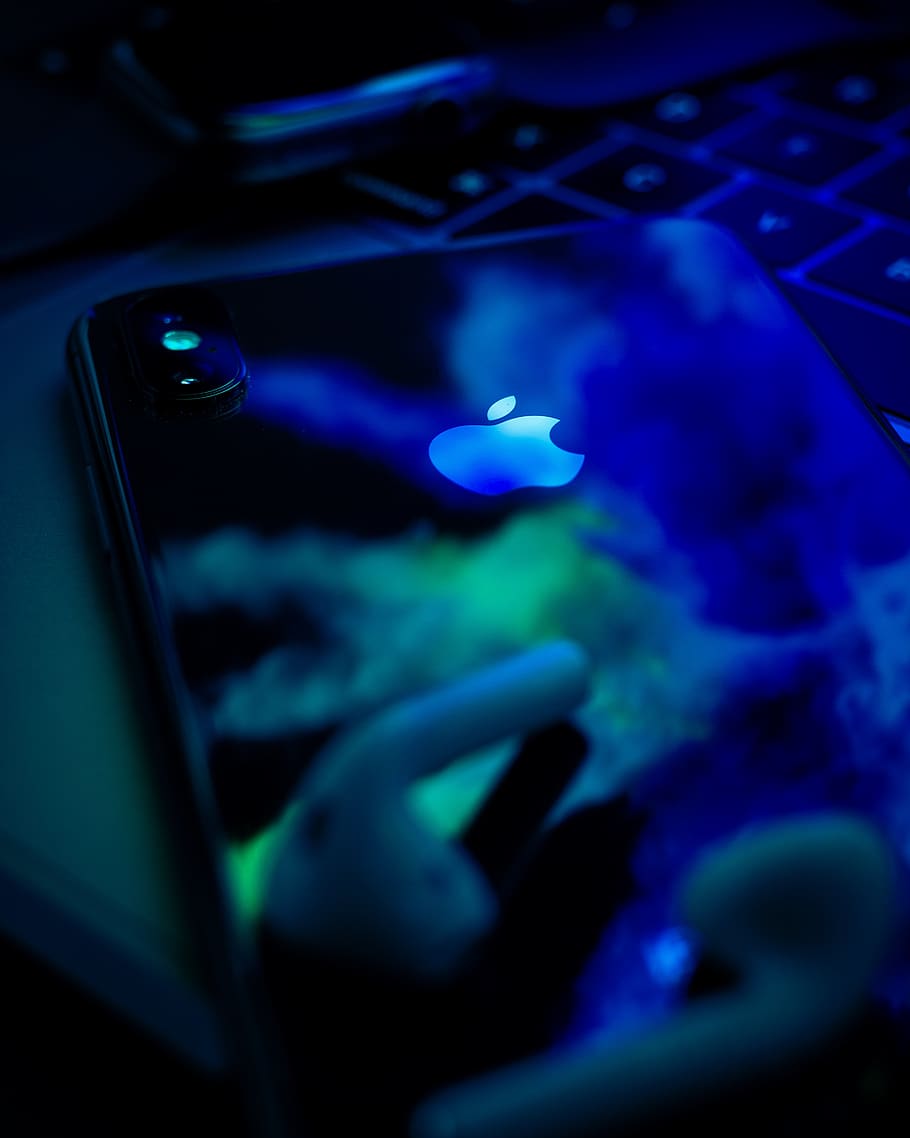 space gray iPhone X on gray laptop computer, blue, close-up, night HD wallpaper