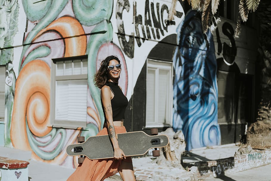 Woman Holding a Longboard While Smiling, active, activity, art, HD wallpaper