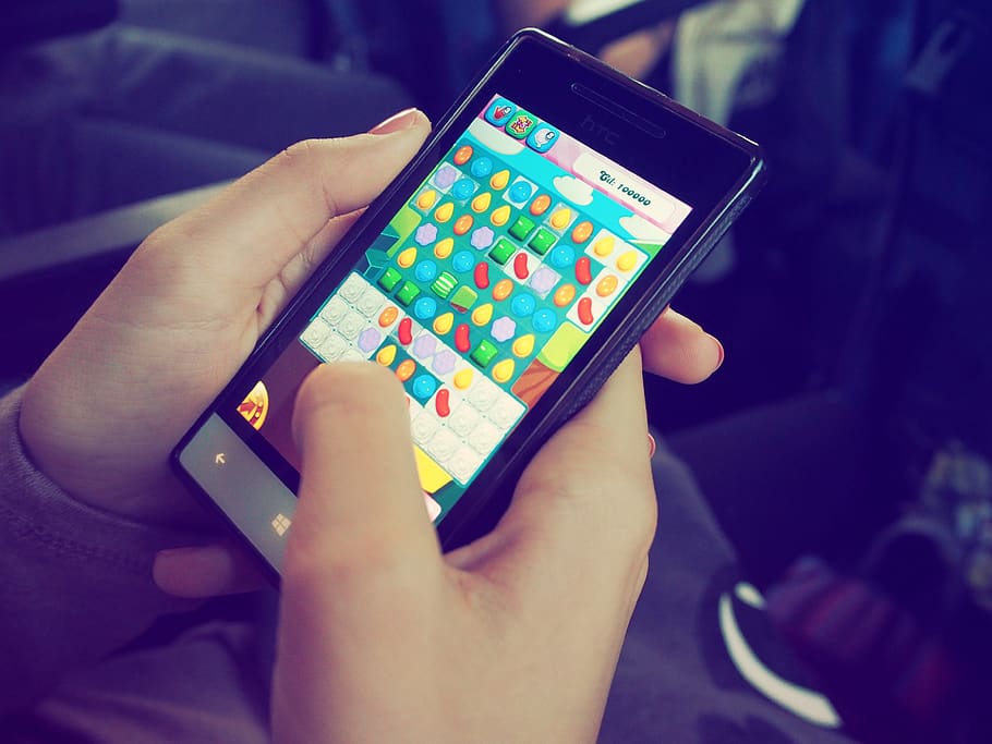 Person Playing Candy Crush on Nokia Smartphone, device, electronics