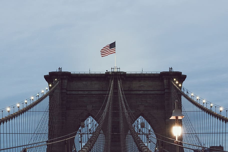 Brooklyn Bridge with string lights, flag, architecture, patriotism HD wallpaper