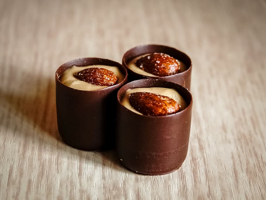 three chocolates with almonds on top, food and drink, wood - material HD wallpaper