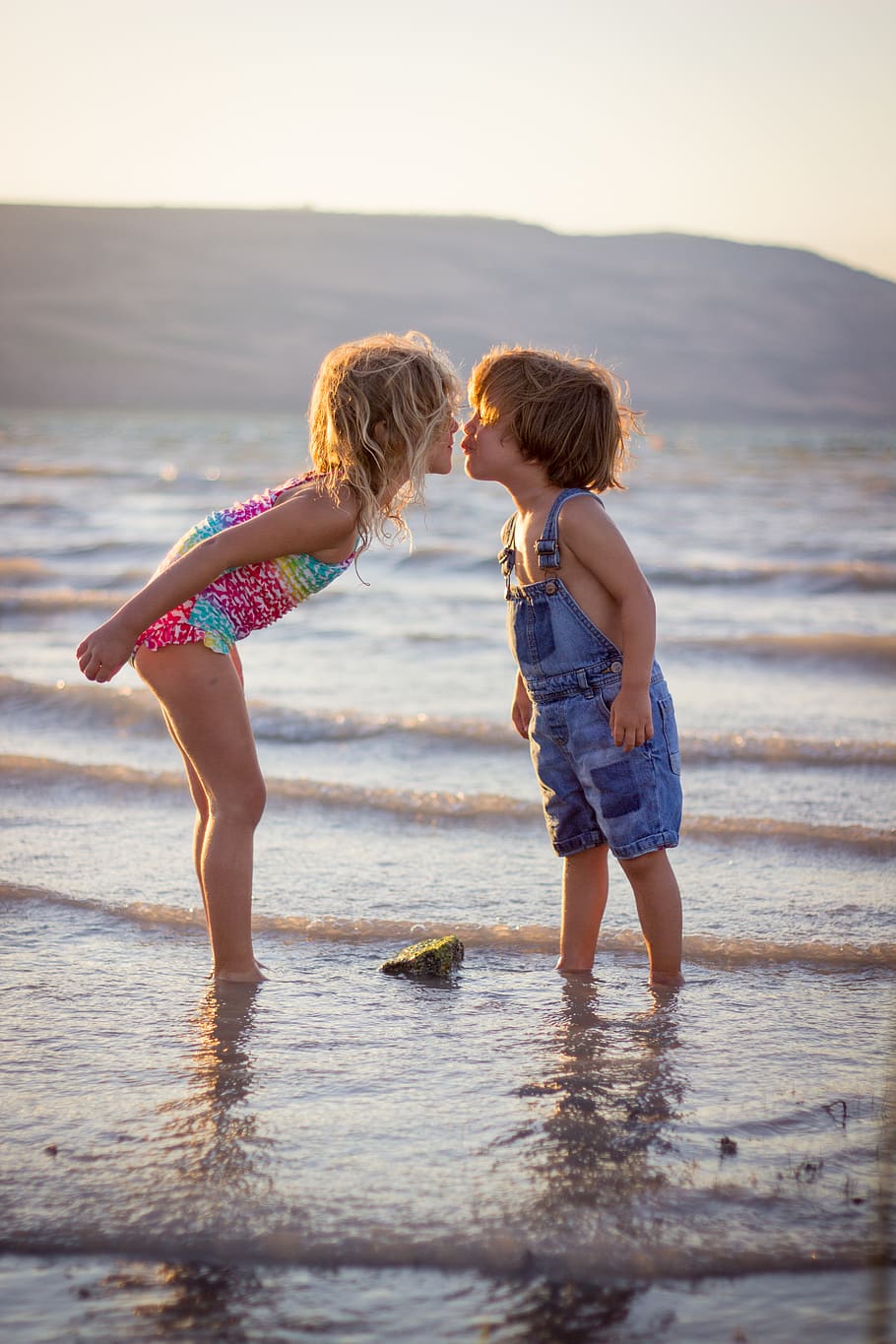 HD wallpaper: girl and boy kissing on beach during daytime, water,  childhood | Wallpaper Flare