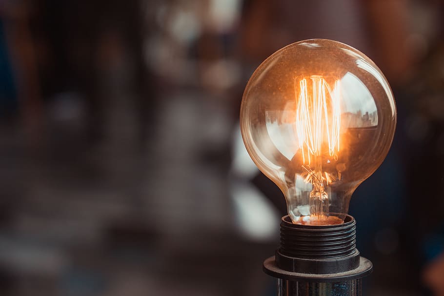Selective Focus Photography of Turned-on Light Bulb, blurred background HD wallpaper