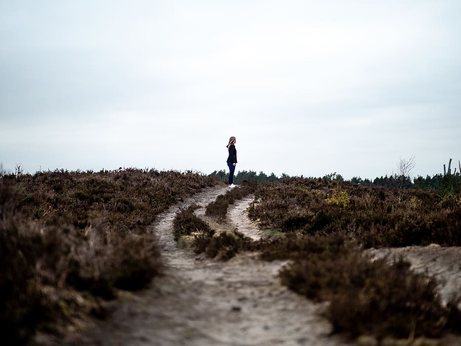 person standing on dirt path, ground, human, road, dirt road HD wallpaper
