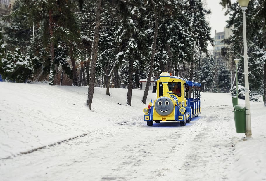 Yellow And Blue Train On Road, cold, park, resort, season, snow HD wallpaper