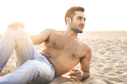 man lying while doing modeling pose at sand, shirtless, beach HD wallpaper
