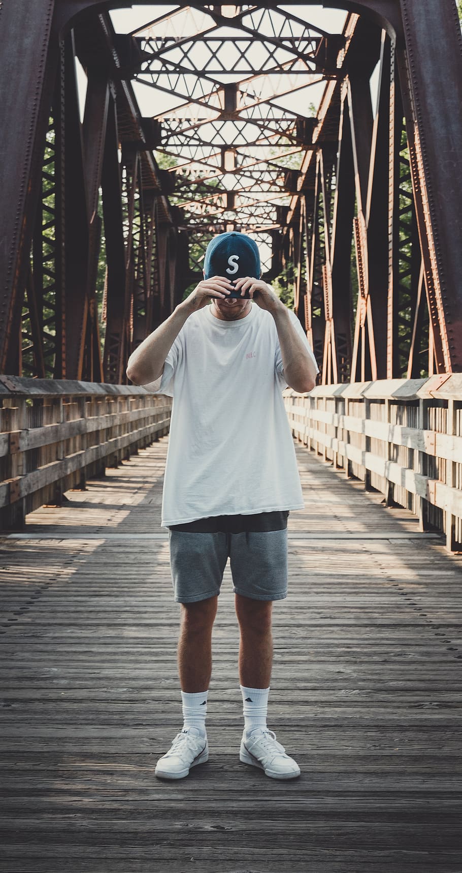 Man in White Crew-neck T-shirt Standing on Bridge, architecture HD wallpaper