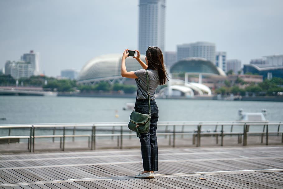 Woman Standing Taking Picture of Scenery, architecture, bay, blurred background HD wallpaper
