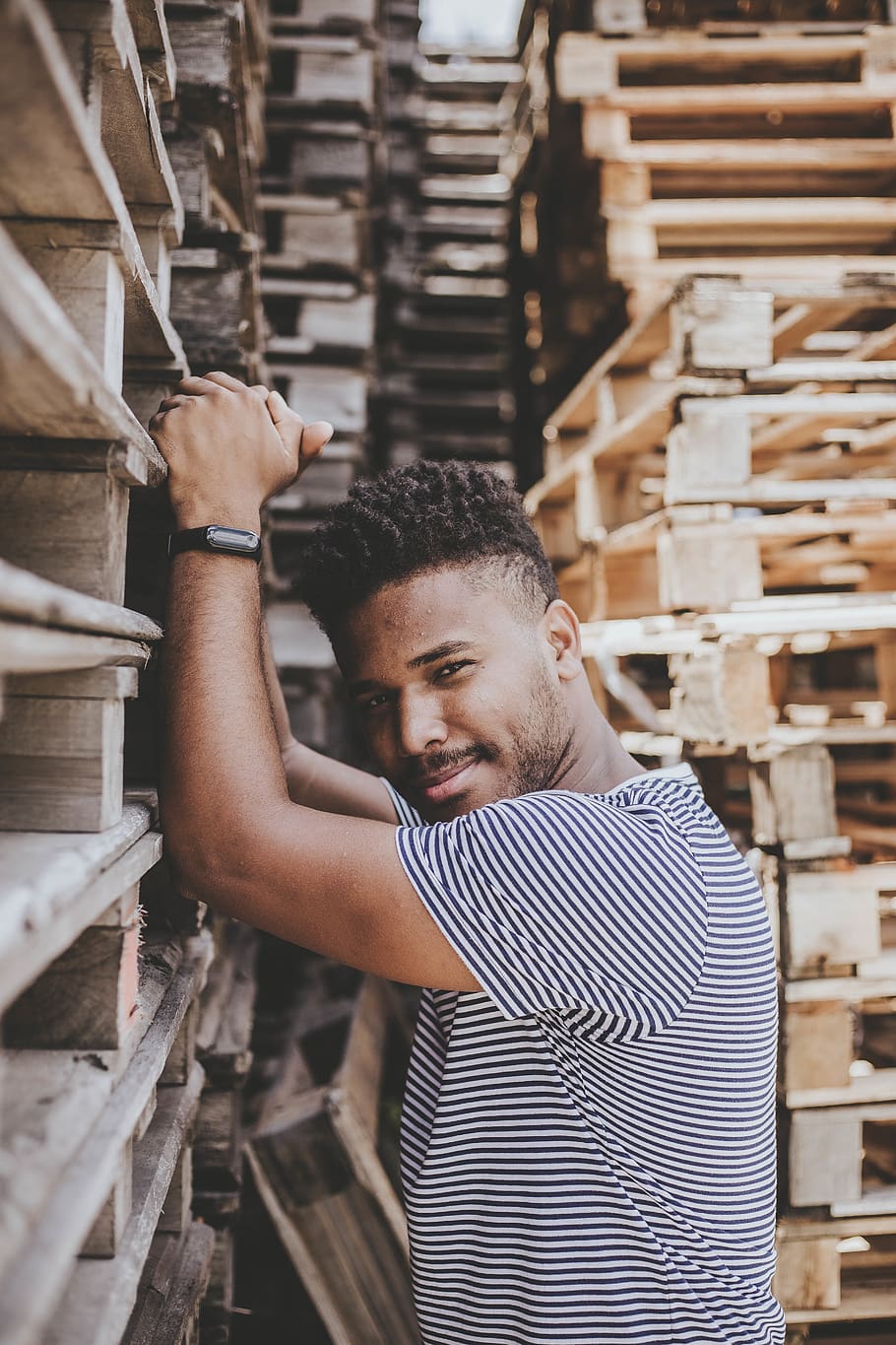 Man Standing Beside Wooden Pallet, daylight, facial expression HD wallpaper