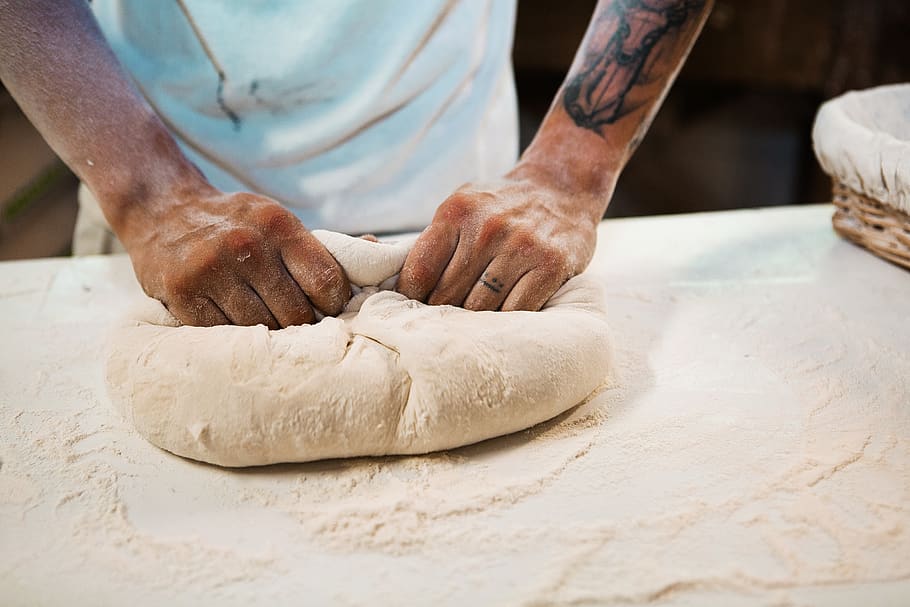 man holding dough, food, human, person, skin, tattoo, flour, powder