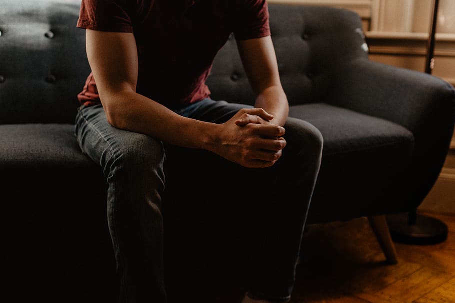 man sitting on sofa, one person, indoors, domestic room, living room HD wallpaper