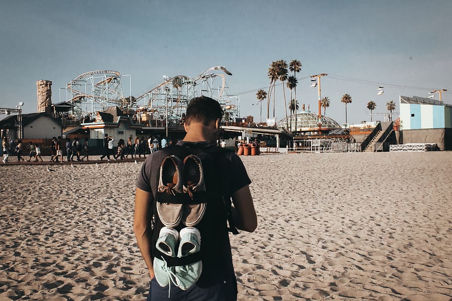 Man Standing in Beach Facing Rides, daylight, daytime, landscape HD wallpaper