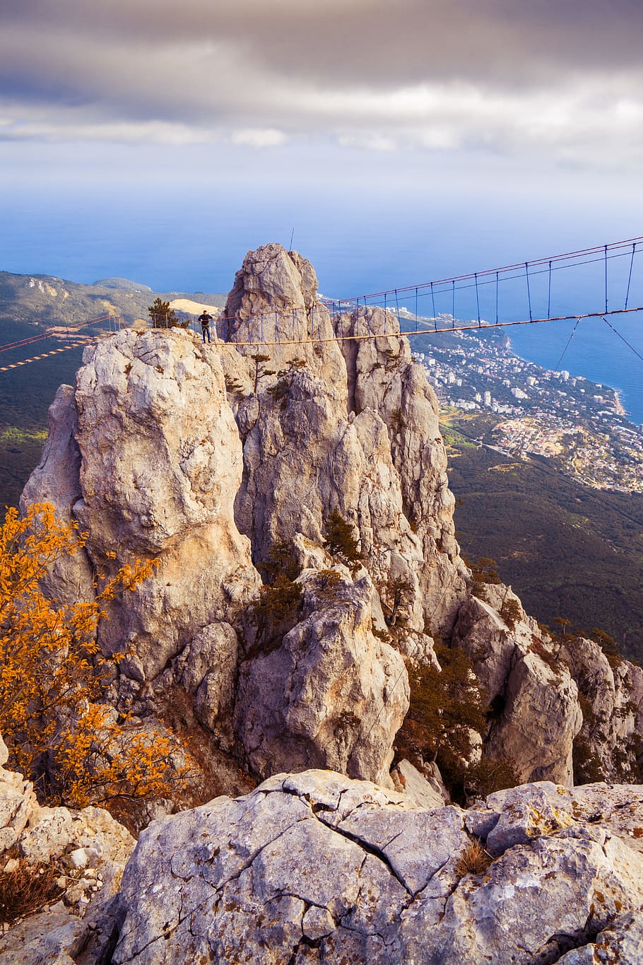Beige Rock Mountain With Bridge, beach, clouds, countryside, daylight HD wallpaper
