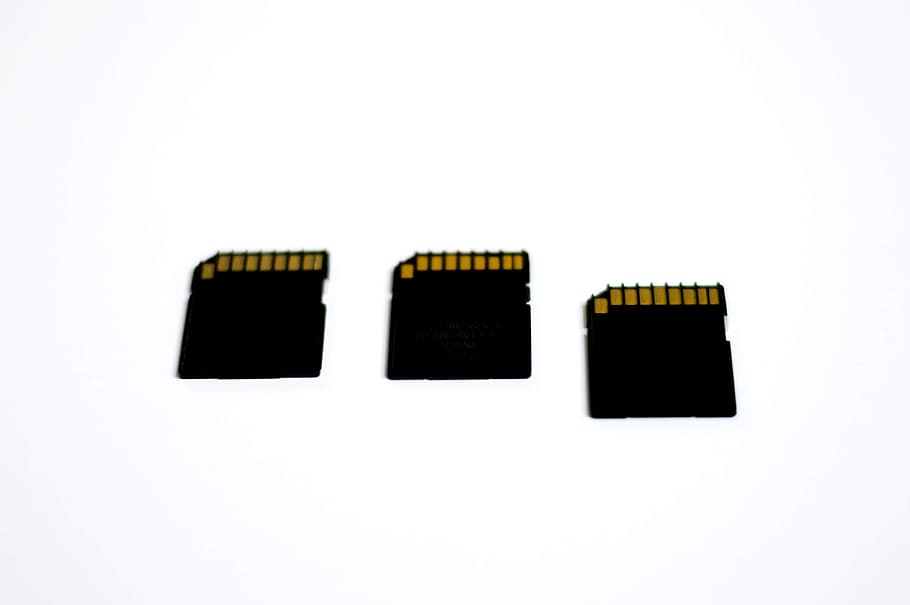 Three Black Memory Cards, chips, storage, white background, studio shot HD wallpaper