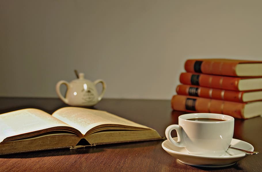 White Ceramic Teacup on Brown Wooden Table Beside Book, books HD wallpaper