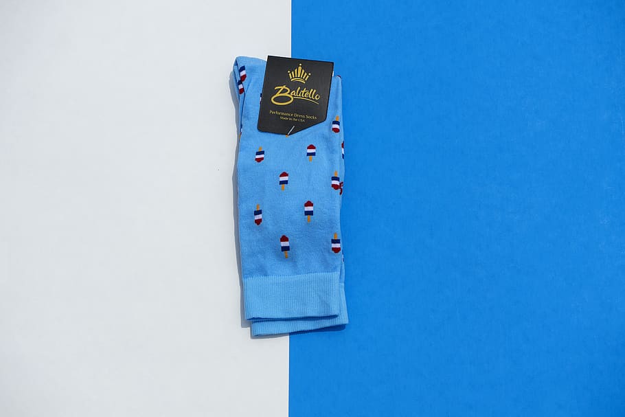 folded blue sock, socks, rocks, accessories, blue and white, product shot HD wallpaper
