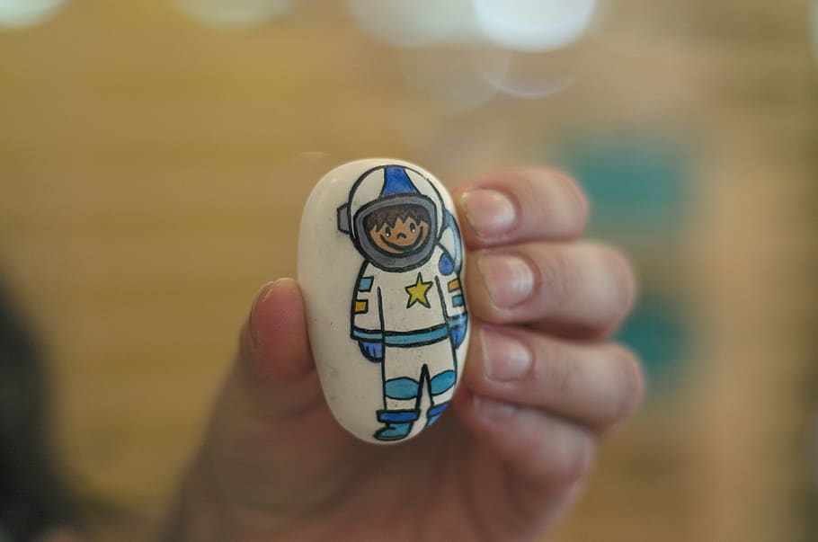 astronaut, art, stone, hand, human hand, one person, holding HD wallpaper