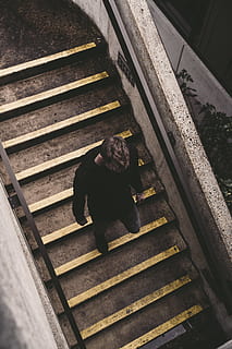 man walking on stairs, banister, handrail, person, human, staircase HD wallpaper