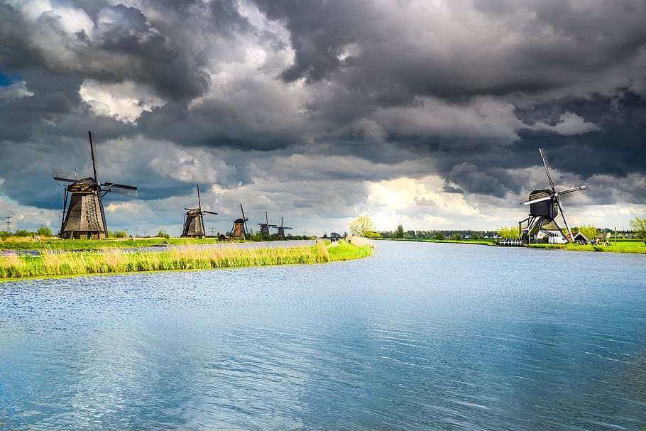 Wind Mills Near Body of Water, clouds, daytime, energy, environment HD wallpaper