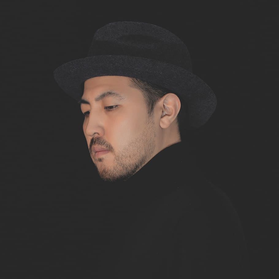 man wearing black hat, black background, portrait, headshot, clothing HD wallpaper