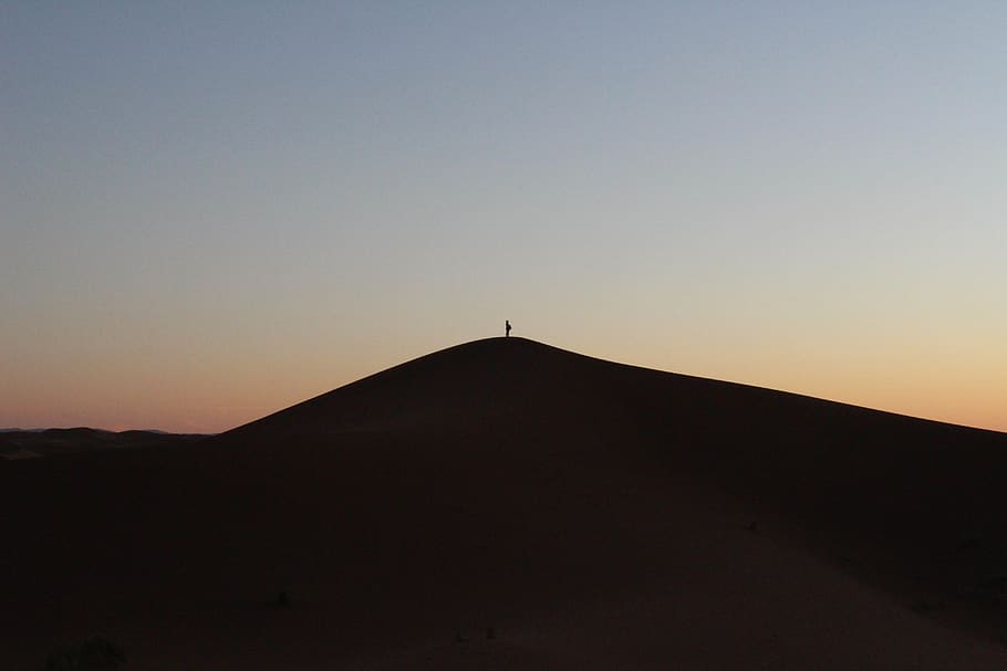 person on desert, sky, sunset, silhouette, copy space, nature HD wallpaper