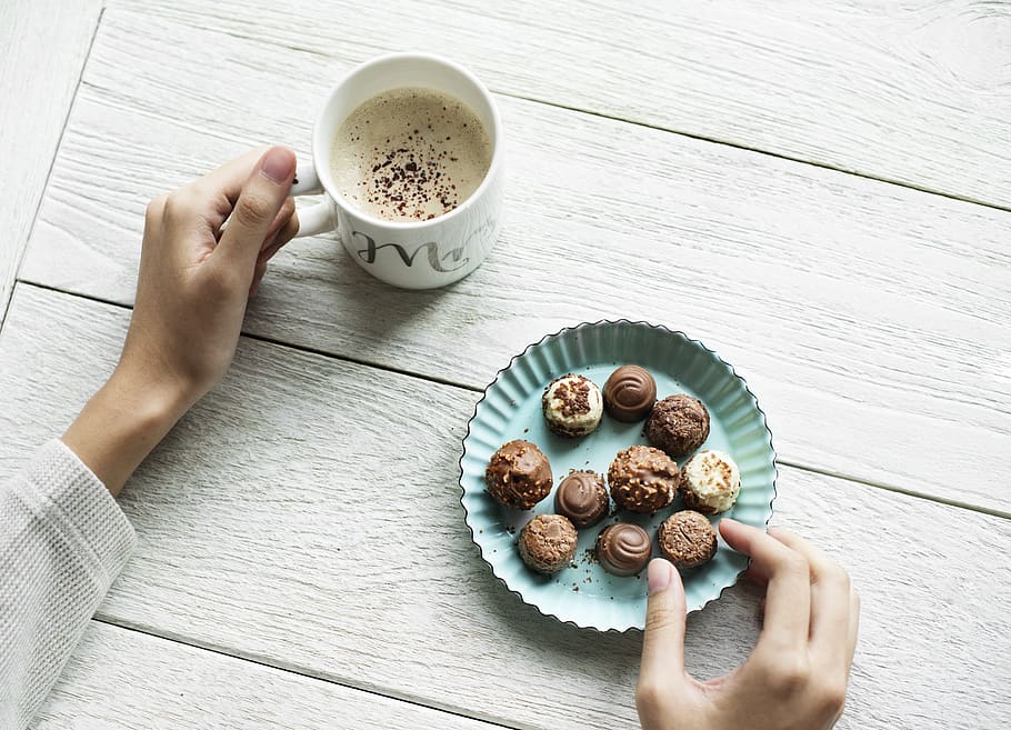Person Holding Chocolates And White Ceramic Mug, beverage, coffee HD wallpaper
