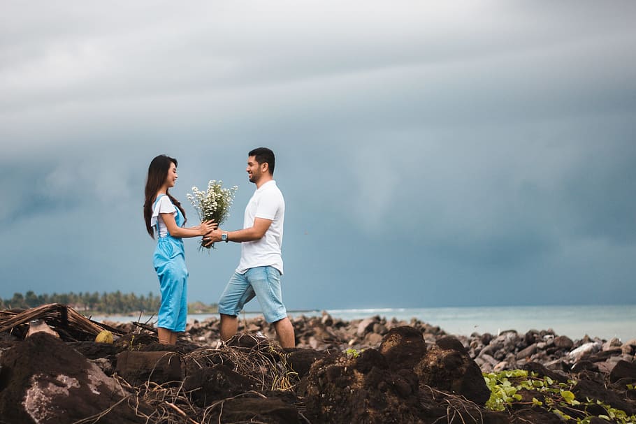 Photo of Man Giving Flowers to Woman, beach, clouds, cloudy, couple HD wallpaper