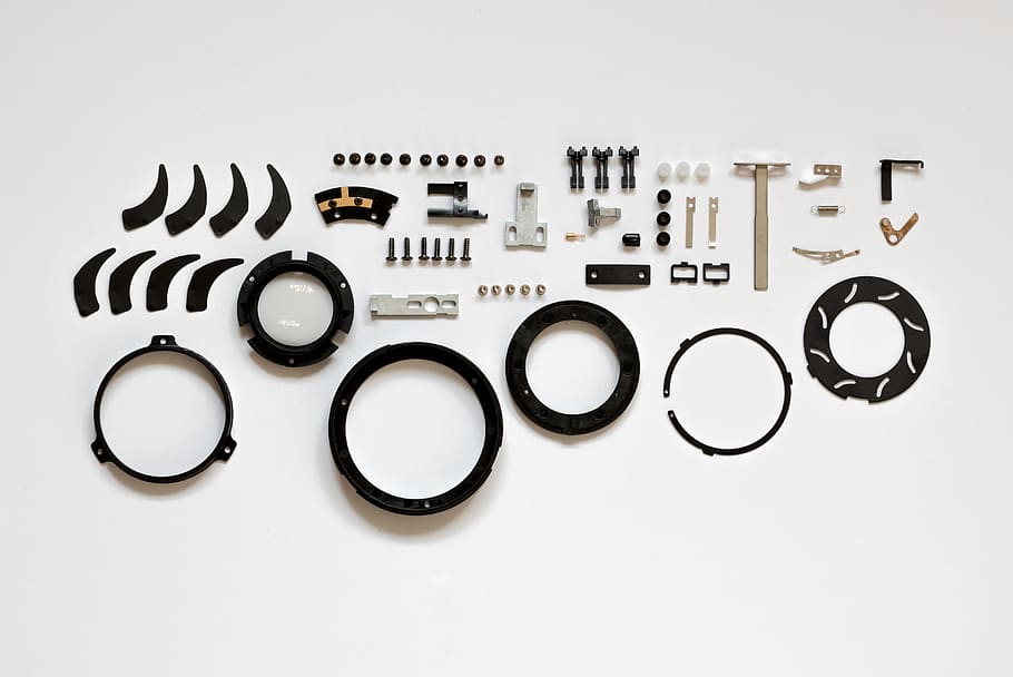 Assorted Item Lot on White Surface, broken, close-up, focus, gear HD wallpaper