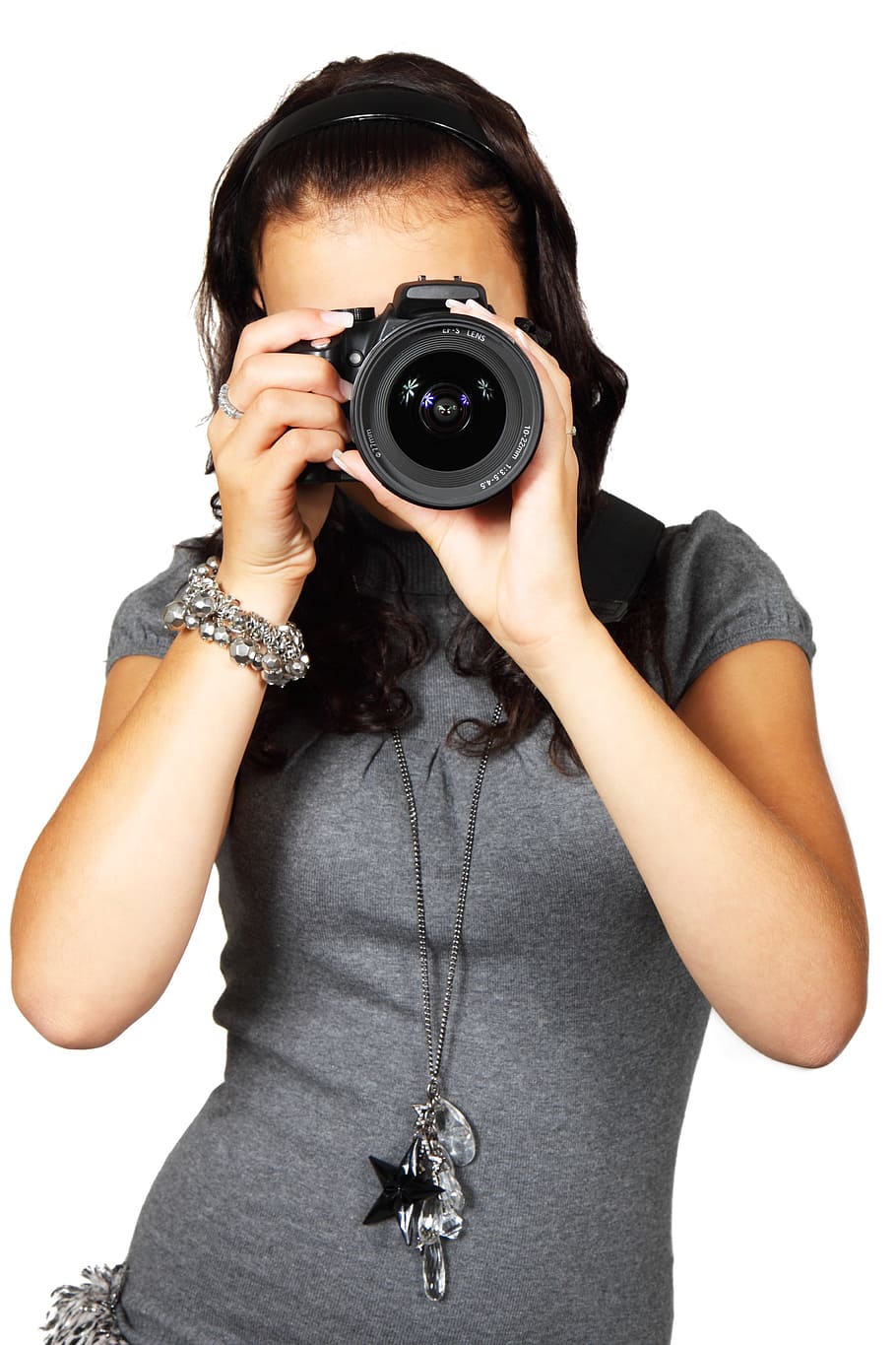 Hold that pose. Shot of an surprised young woman holding a camera Stock  Photo - Alamy