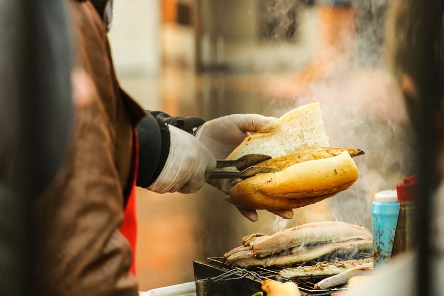 Person Putting Grilled Food in Sliced Bread, blur, close-up, cook HD wallpaper