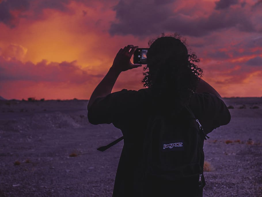 Man Taking Photo Of Sunset, backlit, dawn, desert, person, sunrise HD wallpaper