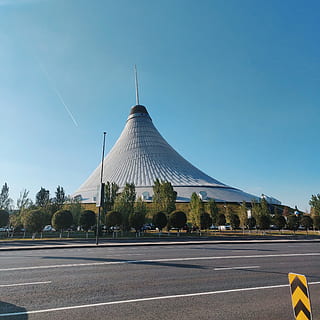 cone-shape gray building, road, tower, spire, steeple, architecture HD wallpaper