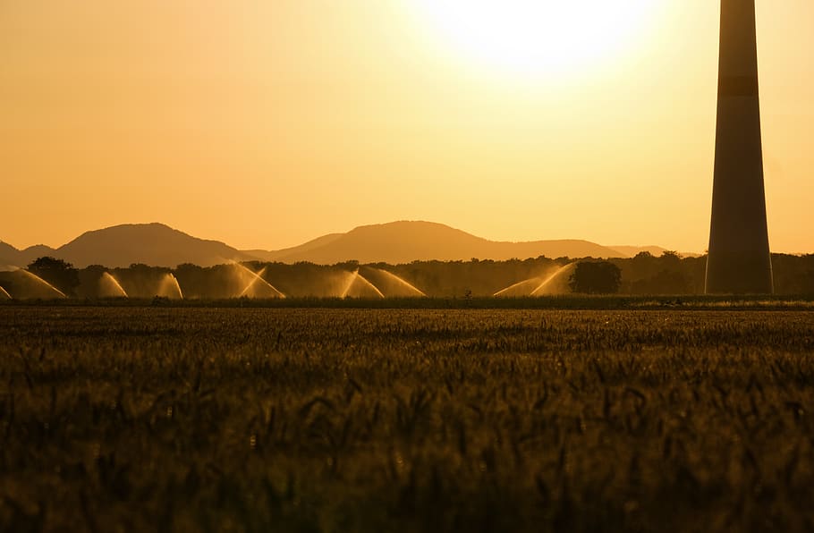 sunset, backlighting, irrigation, pinwheel, dazzle, mood, haze HD wallpaper