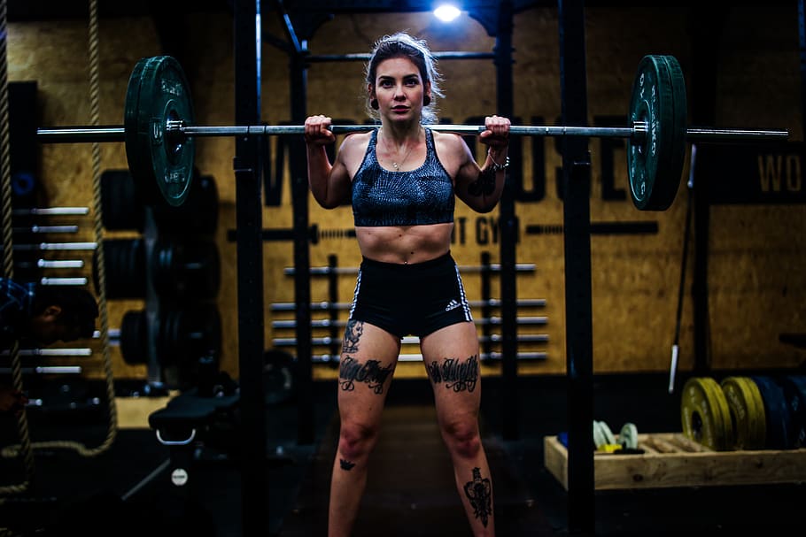 woman standing and carrying barbell, human, person, gym, sports