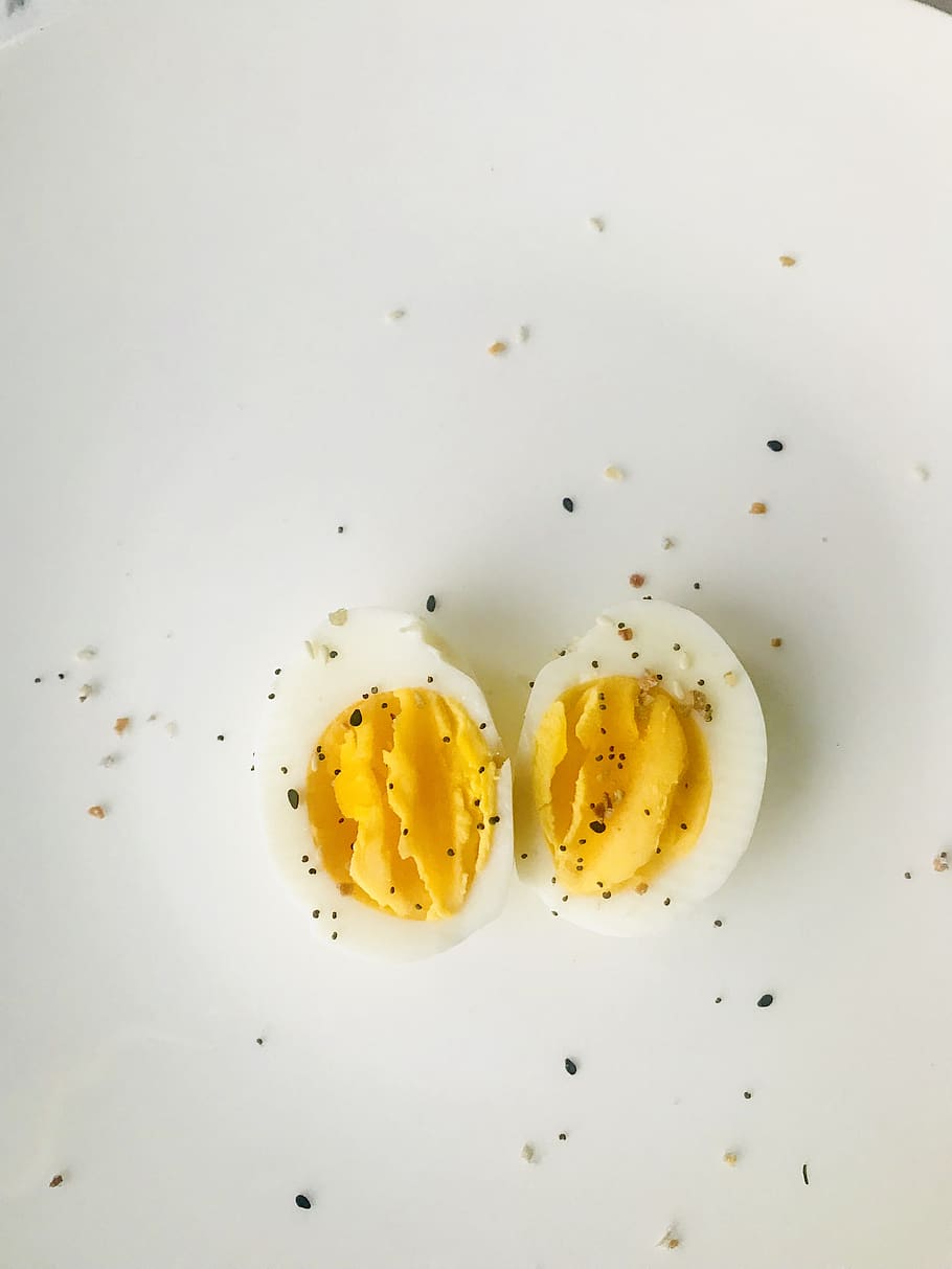 Sliced Boiled Egg on White Plate, creamy, delicious, egg yolk