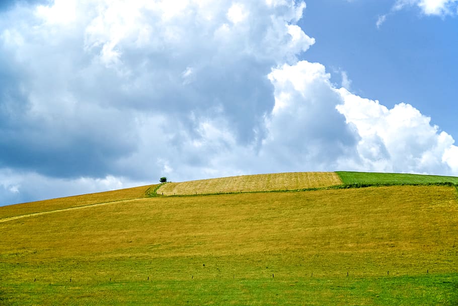 Green Grass Covered Mountain Under White and Blue Skies, calm HD wallpaper