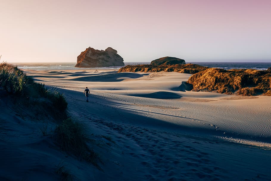 man walking on the sand, sea, sky, beauty in nature, land, scenics - nature HD wallpaper