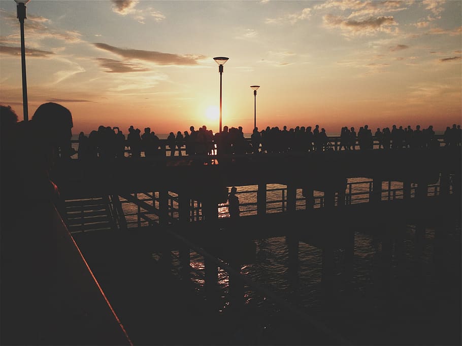 sunset, pier, people, crowd, dusk, silhouette, shadows, sky HD wallpaper