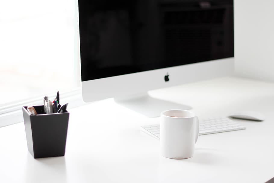 A white Apple computer on a white desk., cup, drink, food and drink HD wallpaper