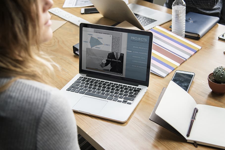 Woman Looking Side Way While Working on Laptop, close-up, desk HD wallpaper