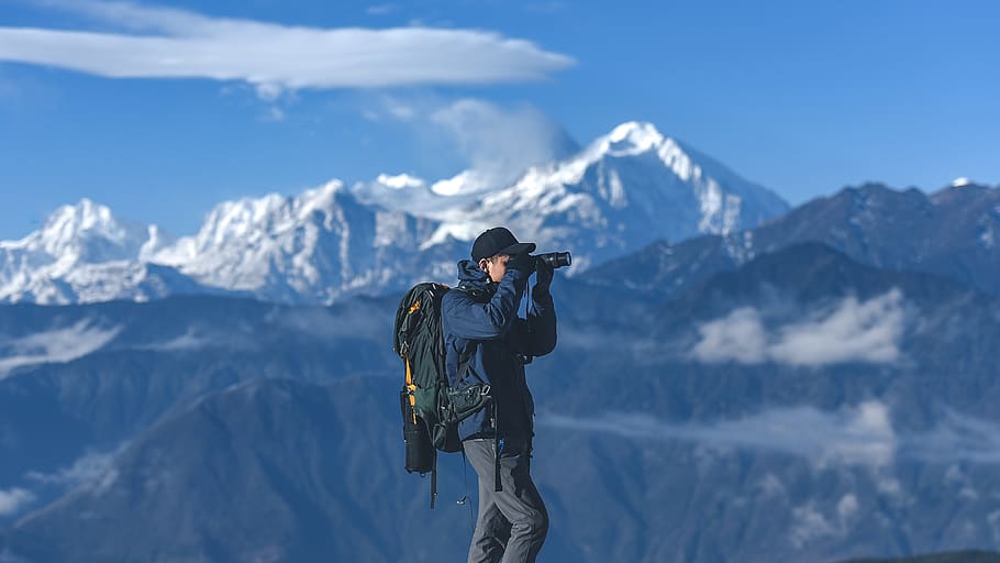 man standing on top of mountain holding binoculars, human, person, HD wallpaper