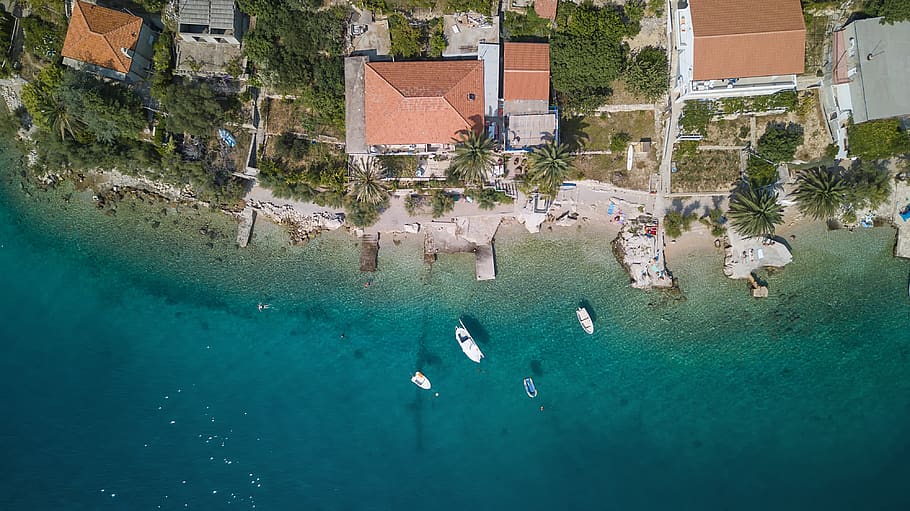 aerial photography of boats on water beside houses, sea, ocean