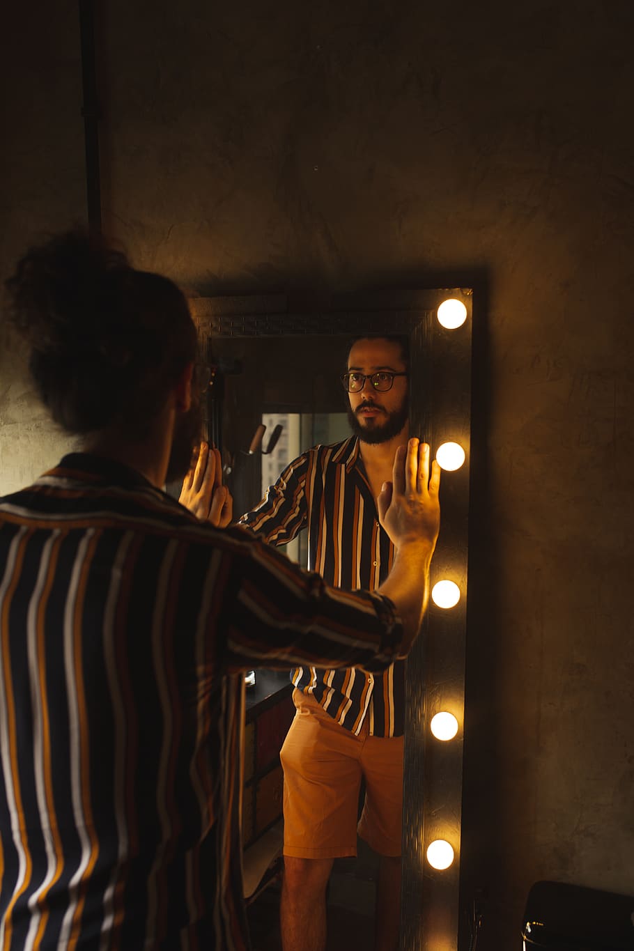 Man Holding Rectangular Mirror, casual, close-up, colors, dark